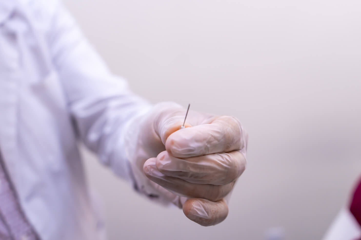 doctor holding blunt needle tip for dermal filler injection in Surrey
