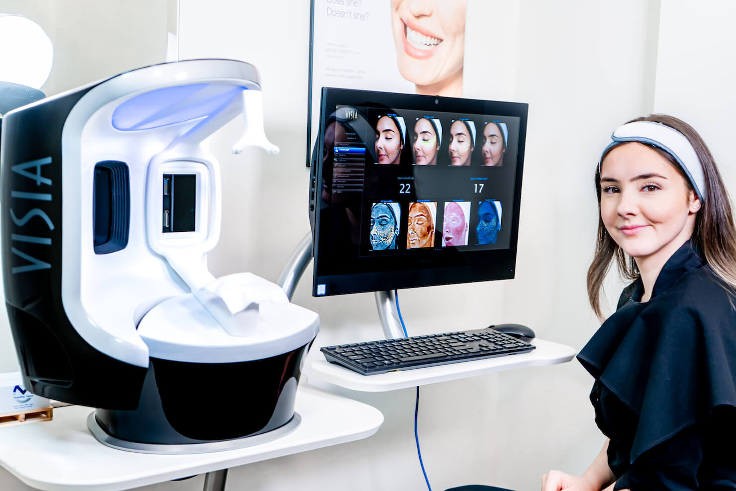 patient viewing visia skin complexion analysis results from uv camera on computer screen