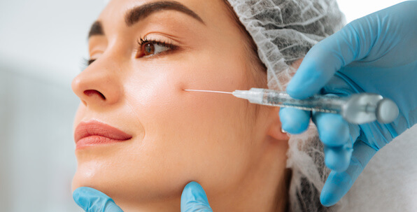 radiesse facial filler being injected for cheek lift on patient