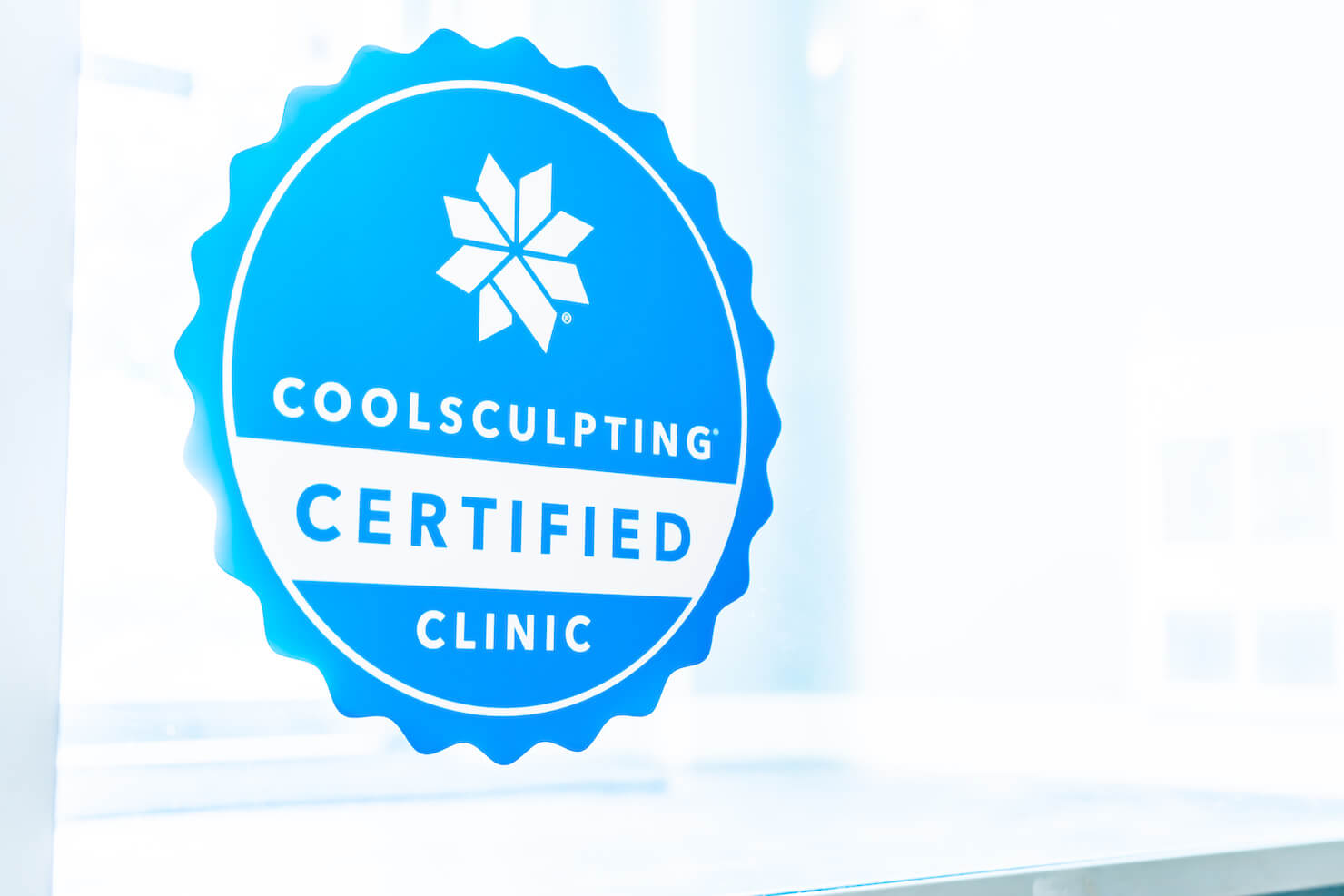 Surrey Coolsculpting certified clinic sticker on window door